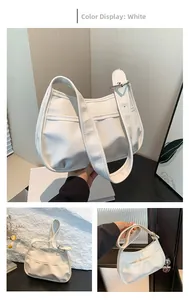 Detailed view of white PU leather hobo bag with adjustable wide shoulder strap