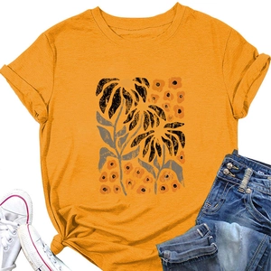 Detail of yellow T-shirt with floral print, round neck and stylish rolled cuffs