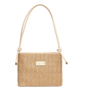 Fashionable straw bucket bag with leather strap and metal details on white background