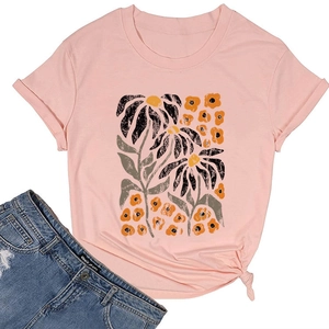 Detailed view of women's floral print pink t-shirt with hem knot detail and round neck