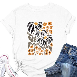 Detail of elegant yellow floral print on white crew neck short sleeve t-shirt fabric