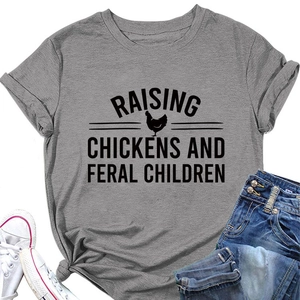 Detail of grey humor chicken t-shirt with knotted hem and cuffed sleeves for a casual look