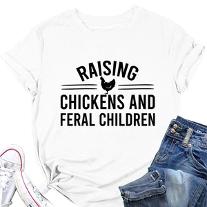 Macro detail of the chicken silhouette and printed slogan on a white cotton t-shirt