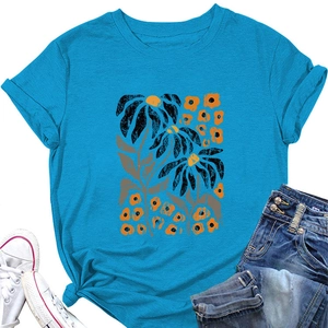 Detail of elegant bright blue t-shirt with abstract floral print and round neck collar