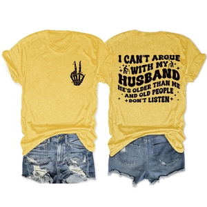 Flat lay of yellow t-shirt with black bone hand gesture and humorous back text