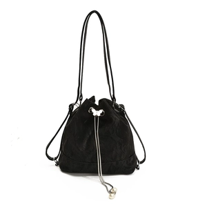 Minimalist black drawstring bucket backpack for women with silver butterfly hardware