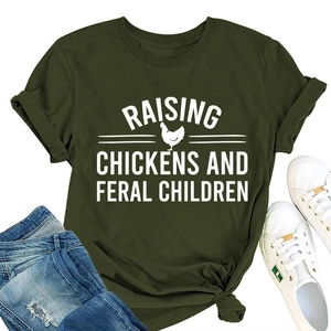 Flat lay of army green cotton T-shirt with raising chickens print and ripped jeans