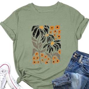 Flat lay of green short-sleeved floral T-shirt with casual denim shorts and white sneakers