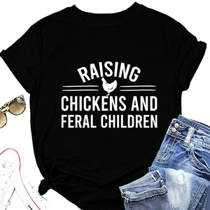 Flat lay of a black cotton t-shirt featuring Raising Chickens and Feral Children print