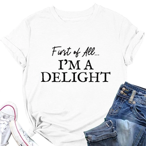 Flat lay of white cotton T-shirt with 'First of All I'm a Delight' print and blue jeans