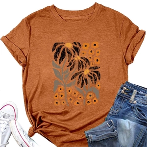 Detail of elegant orange floral t-shirt with rolled sleeves and front knot design