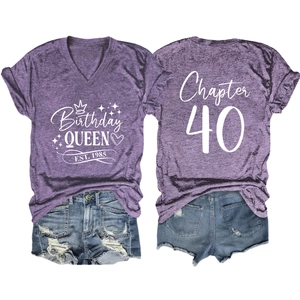 Detailed flat lay of purple V-neck T-shirt and denim shorts with Birthday Queen print