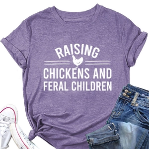Detail of burgundy T-shirt with Raising Chickens print, knotted hem and casual styling