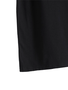 Detailed close-up of double-needle stitching on the hem of a black jersey vest