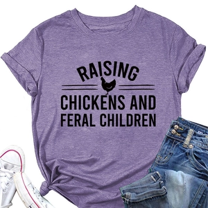 Detail of purple graphic tee with Raising Chickens text, knotted hem and crew neck