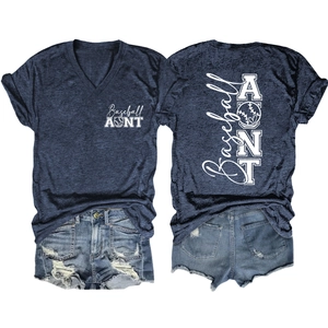 Flat lay view of a V-neck Baseball Aunt t-shirt and ripped denim shorts on white background