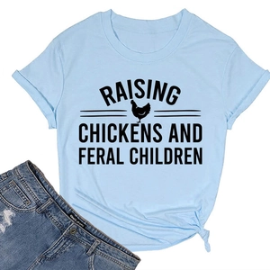 Detail of light blue cotton T-shirt featuring Raising Chickens text and rooster graphic