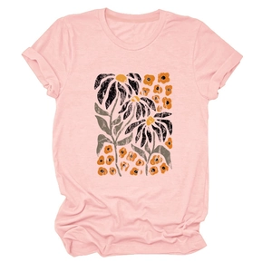 Detailed view of floral sunflower print on pink crew neck cotton t-shirt fabric
