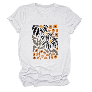 Detailed close-up of white T-shirt featuring vintage yellow floral and leaf print