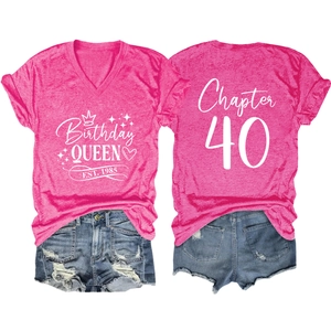 Detail view of pink V-neck t-shirt with Birthday Queen print and ripped denim shorts