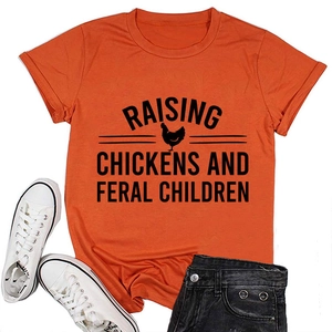 Detail of orange cotton T-shirt featuring Raising Chickens and Feral Children print