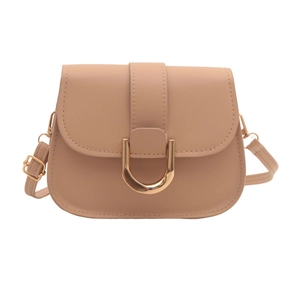 Chic beige crossbody saddle bag with gold U-shaped hardware on a clean white background