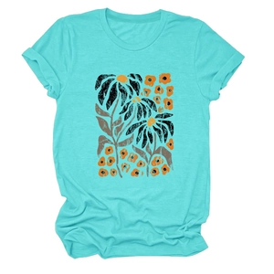 Detail of elegant mint green cotton T-shirt featuring abstract sunflower print pattern
