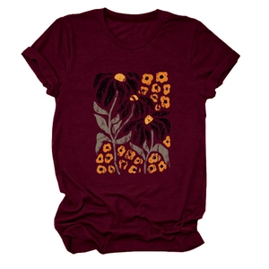 Close-up of vintage floral print and round neckline on burgundy cotton short-sleeve T-shirt