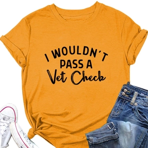 Detail of yellow cotton t-shirt with I Wouldn't Pass A Vet Check print and knotted hem