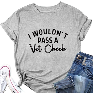 Flat lay of gray cotton t-shirt with I WOULDN'T PASS A Vet Check slogan and denim shorts