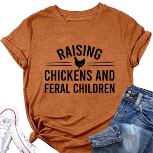 Detailed texture of caramel brown cotton T-shirt with chicken graphic and slogan