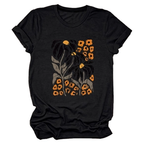 Detail of artistic yellow flower and leaf print on black short sleeve t-shirt