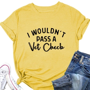 Flat lay of mustard yellow t-shirt with Vet Check slogan paired with jeans and shoes