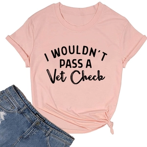Detail of pink cotton T-shirt featuring 'I WOULDN'T PASS' slogan and knotted hem design