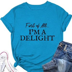 Close-up of bright blue cotton t-shirt featuring black text print and side knot detail