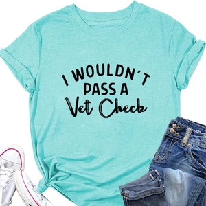 Detail of mint green cotton T-shirt featuring black 'I WOULDN'T PASS' slogan print