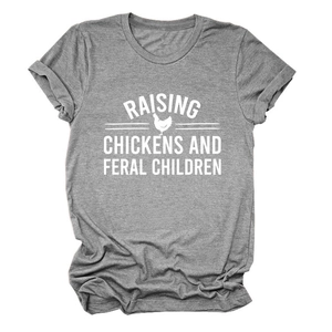 Close-up of funny Raising Chickens and Feral Children text print on a grey cotton t-shirt