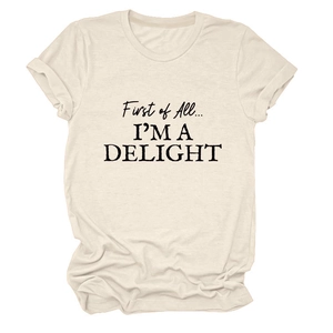 Detailed view of the 'First of All... I'M A DELIGHT' slogan print on a beige crew neck t-shirt