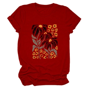 Close-up of elegant floral print and texture on deep red short sleeve crewneck T-shirt