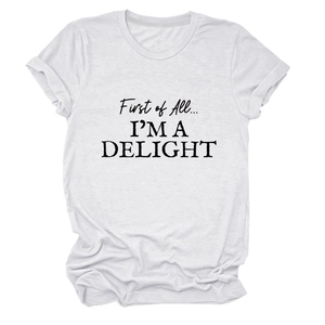 Close-up of black 'First of All I'M A DELIGHT' lettering on a white cotton T-shirt