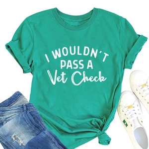 Detail of mint green t-shirt with I Wouldn't Pass A Vet Check text and knotted hem