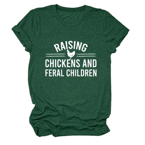 Close-up of dark green cotton T-shirt featuring Raising Chickens text and rooster silhouette