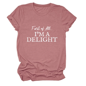 Detail of rolled cuffs and white printed slogan on a dusty pink crewneck T-shirt