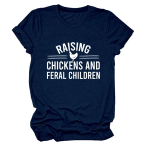 Detail of navy cotton T-shirt featuring Raising Chickens and Feral Children white graphic