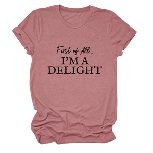 Detail of dusty pink crew neck t-shirt with First of All I'm a Delight slogan print