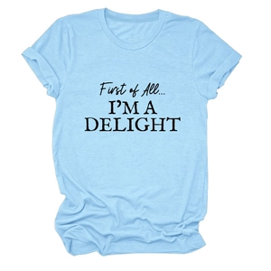 Detail of light blue cotton T-shirt featuring 'First of All I'M A DELIGHT' slogan print