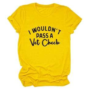 Close-up of ginger yellow crew neck t-shirt with bold black text print detail