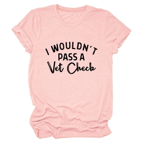 Detailed view of pink T-shirt with black I Wouldn't Pass A Vet Check text print