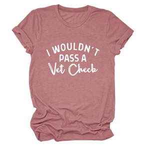 Detail of dusty rose T-shirt with white I Wouldn't Pass A Vet Check slogan and rolled sleeves