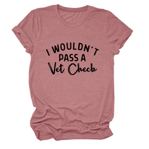 Detailed flat lay of pink cotton T-shirt featuring 'I WOULDN'T PASS A Vet Check' print